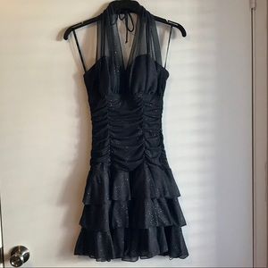 Short ruffled, jeweled event dress.